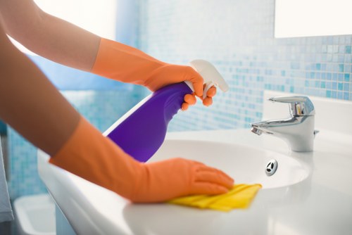 Bathroom end of tenancy cleaning with attention to taps and tiles