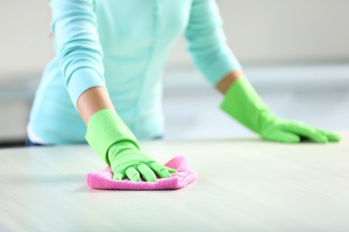 Technician cleaning a hallway carpet in a Ruislip residential property
